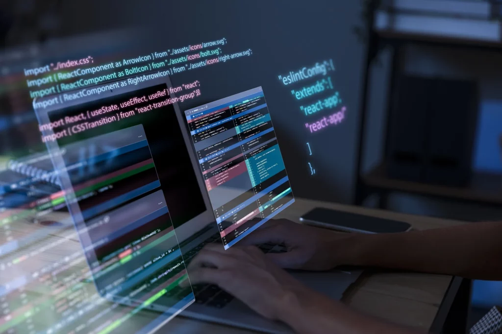 Une personne en train d'utiliser un ordinateur avec des lignes de code qui ressortent de l'écran